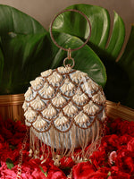 Decorative handbag with shell-like patterns on a red floral and green leaf background