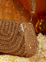 Gold beaded clutch with a letter 'A' on a decorative background