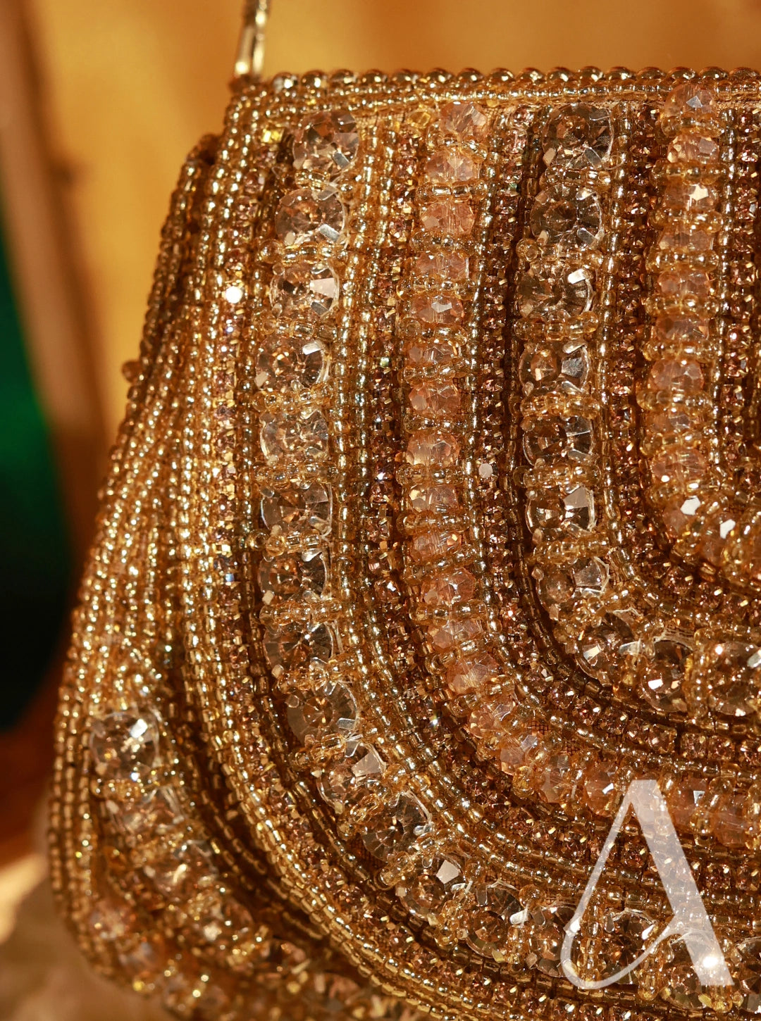 Close-up of a gold beaded handbag with intricate design