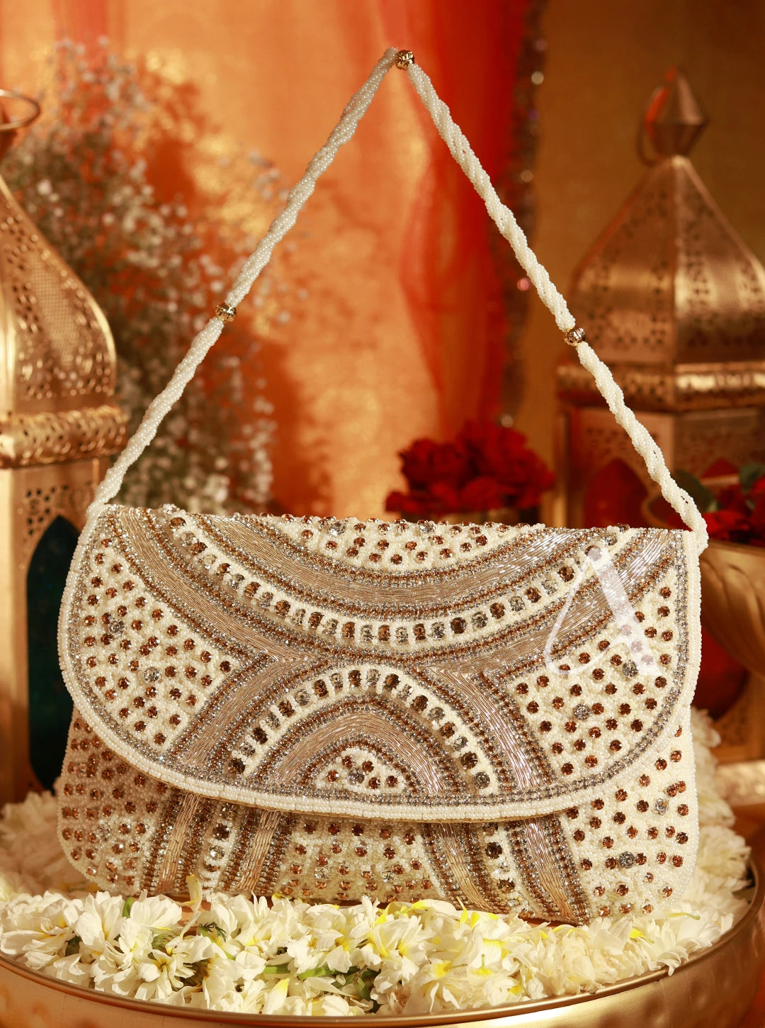 Decorative handbag with intricate patterns on a floral and lantern background