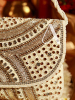 Close-up of a decorative handbag with intricate beadwork and embroidery.