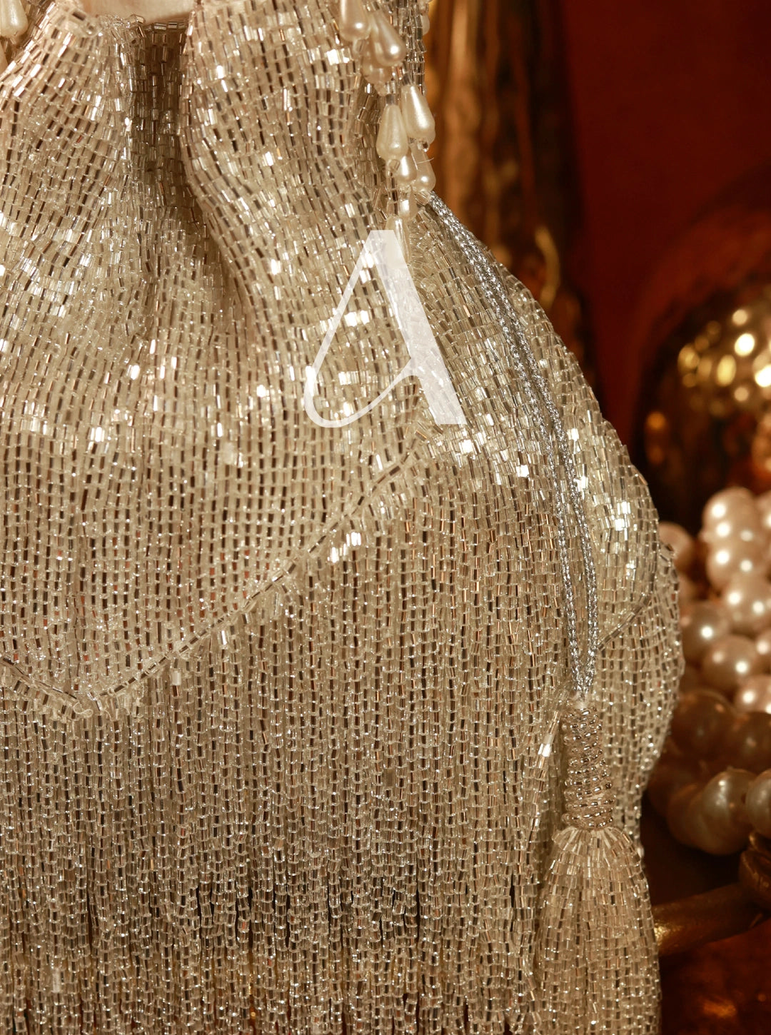 Close-up of a gold sequin dress with a blurred background