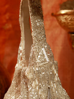 Close-up of a beaded handbag with a blurred background