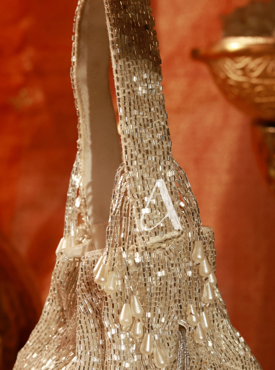 Close-up of a beaded handbag with a blurred background
