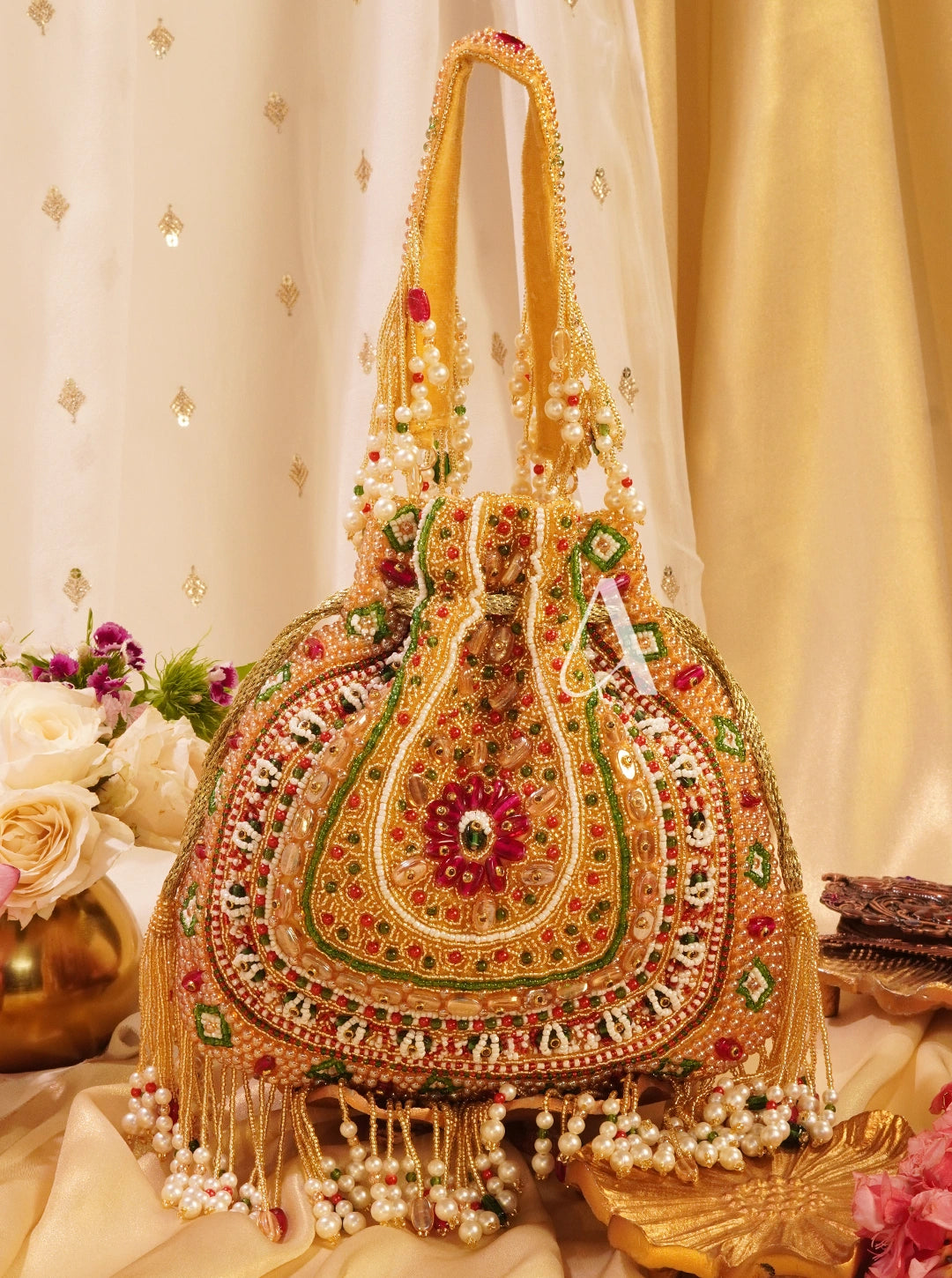 Decorative handbag with intricate designs and embellishments on a floral background