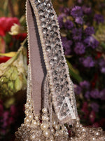 Decorative headband with pearls and crystals on a floral background
