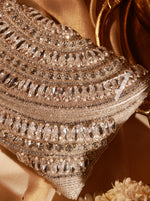 Close-up of a sparkling, ornate clutch bag with intricate detailing.