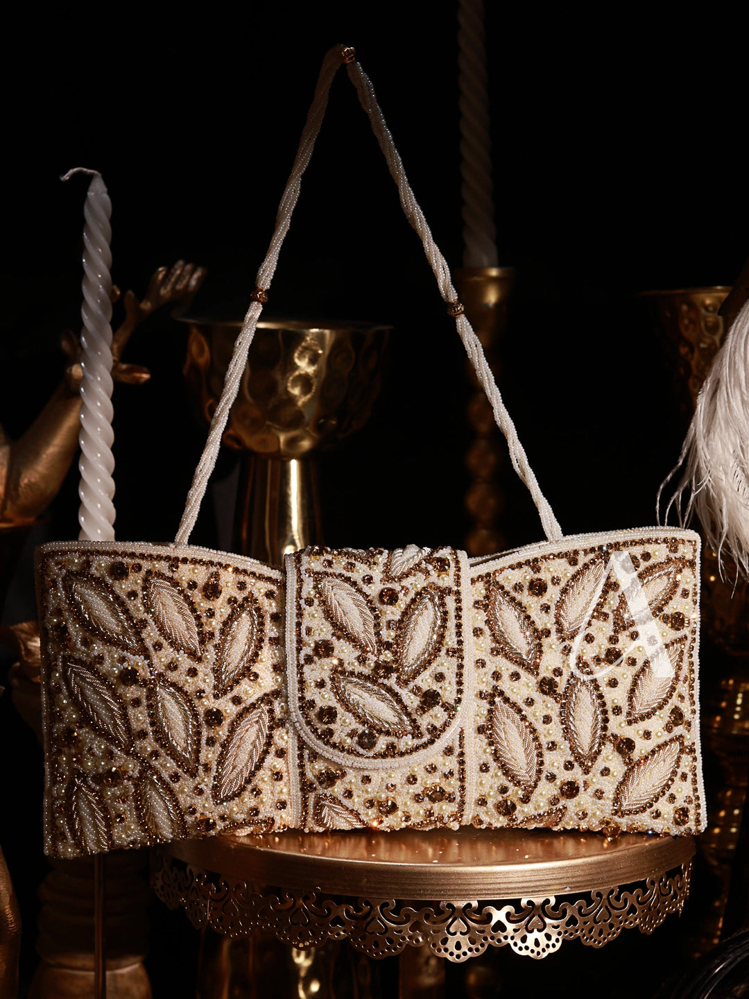 Decorative handbag with intricate beadwork on a dark background