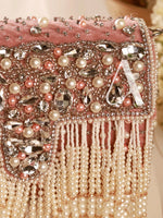 Pink handbag with pearl and crystal embellishments