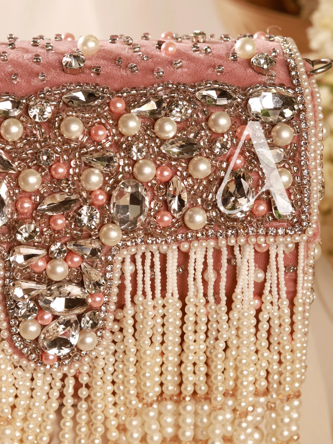 Pink handbag with pearl and crystal embellishments