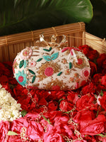 Decorative handbag with floral patterns on a bed of red flowers