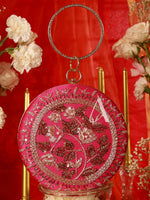Decorative pink round ornament with floral patterns on a red background with flowers.