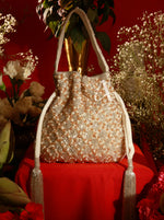 Decorative handbag with floral design on a red background