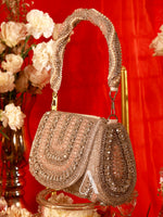 Decorative handbag with intricate designs on a red background