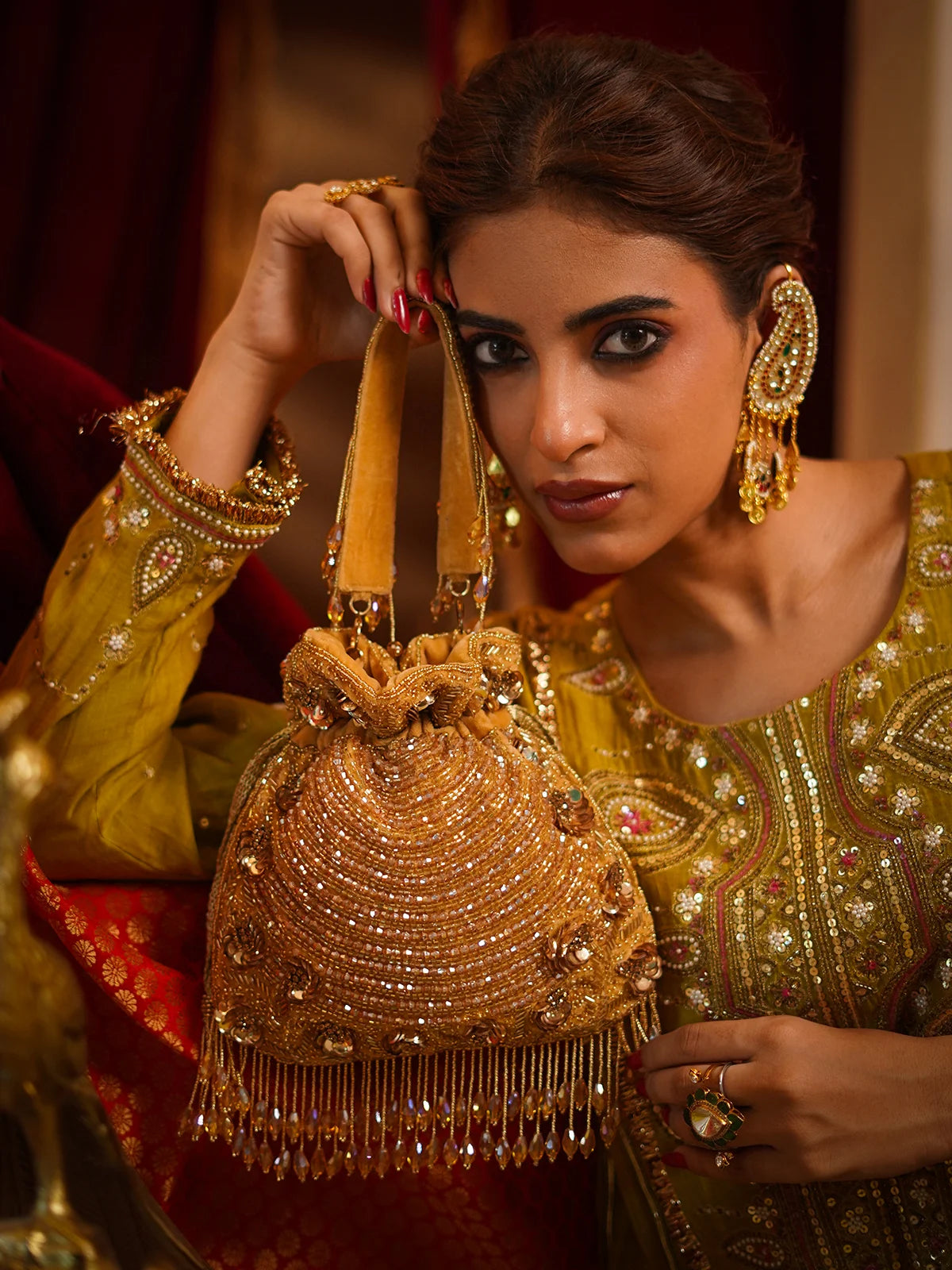 Svarnarekha Antique Gold Potli Bag
