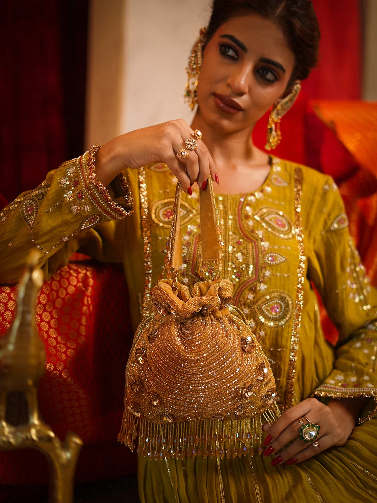 Svarnarekha Antique Gold Potli Bag